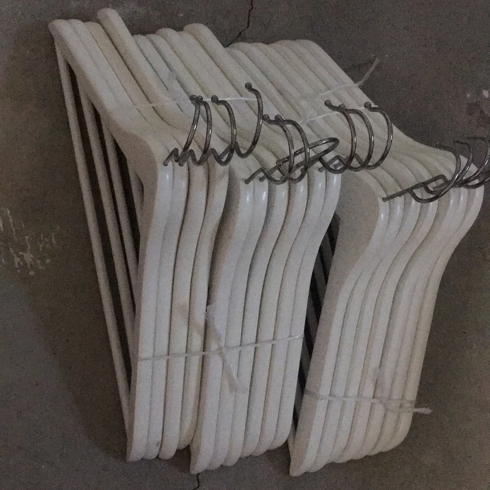White wooden clothing hangers for home